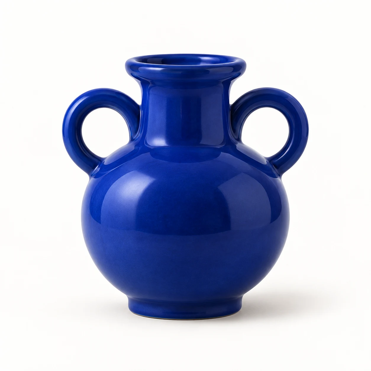 Blue ceramic vase with two handles on a white background